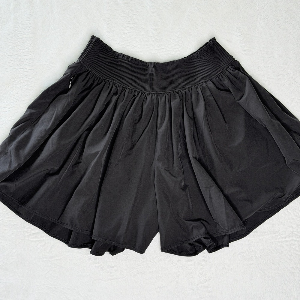 Athleta Sneaky Flutter Running Shorts XS Black Smocked Waist Zip Pocket Unlined